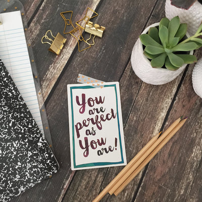 Stylized desk scene with succulents with a Personal Pep Talk strategy card