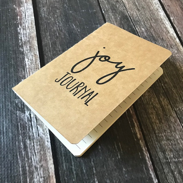 A 4x6 lined paper joy journal to help you find more joy