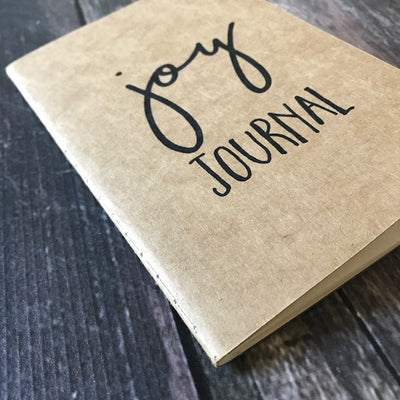 A 4x6 lined paper joy journal to help you find more joy